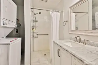 3/4 bath with utility room on main level along with the primary bedroom.