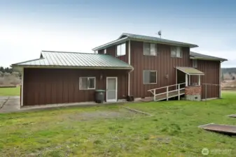 Back view and 3 sheds on lot as well as the barn on lot 2.