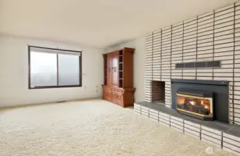 Sitting room with a cozy gas fireplace.