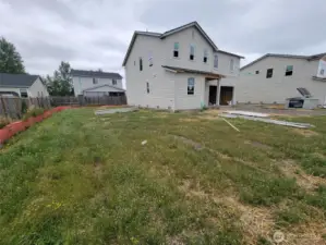 Tucked back in corner w/ large side yard.