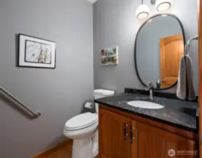 1/2 bathroom just off the garage area.