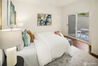 The Primary bedroom with doors directly to the private patio.
