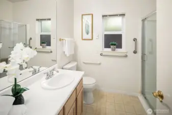 The 3/4 hall bath has a pull down bench seat in the walk-in shower.