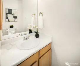 The half bath accessed through the Primary bedroom.