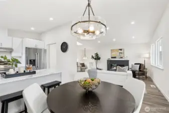 Spacious open-concept floor plan uniting the kitchen, dining, and living areas on the same level - perfect for gatherings and flexible living.