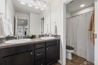 Upstairs main bathroom. Double Vanity, Shower and toilet