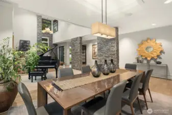 Open flow with the soaring living area, awash in light from clerestory windows.