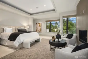 Your primary suite offers a romantic fireplace and private deck overlooking glimpses of Lake Washington.