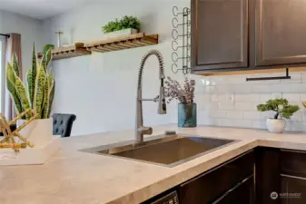 Whether you're preparing a quick weeknight dinner or hosting a gathering, this kitchen is sure to delight the chef of the household with its functionality and style.