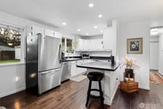 Beautiful updated kitchen with counter for casual eating