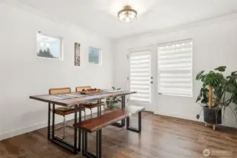 Dining room is open to the kitchen and family room and accesses the fenced yard!