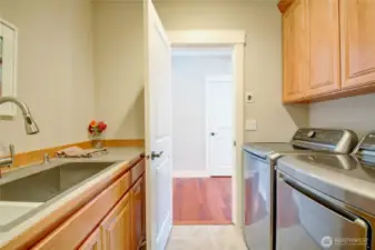 Laundry with plenty of storage, large sink.