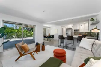 Here's a great shot that really shows you how well the kitchen, dining, and living rooms easily flow together. Note the sliding glass doors on your left which lead to your enormous & near 1000 square-foot patio. We will get there in a minute.
