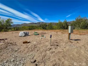 Upper tier site with 3 RV plugs (50amp/30amp/20amp), 1000gal septic & 2 domestic water spigots