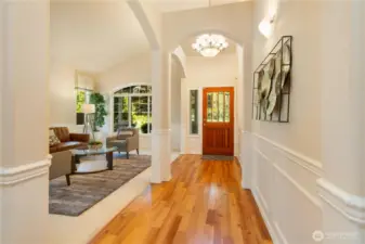 Beautiful wood floor entry and right to the bedrooms
