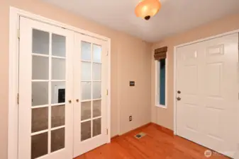 Front door with living room through the French doors.