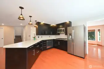 Beautiful kitchen that has room for everyone! Gas cooktop, quartz counters, stainless appliances and plenty of cabinets for all kinds of cook ware.