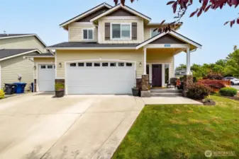 West facing home has large corner, fully fenced yard and 3 car garage