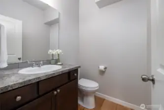 Main level half bath with granite counters
