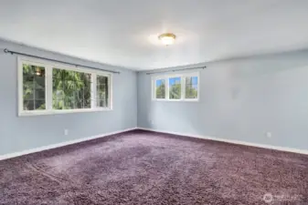Expansive upper bedroom with north, south and west facing windows