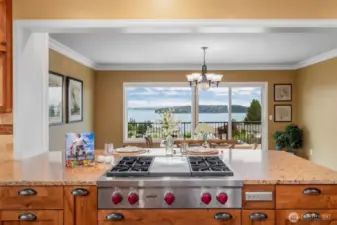 4-burner Wolf gas range-top with large center griddle and downdraft