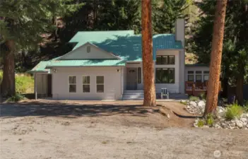 The main home greets you with plenty of parking.