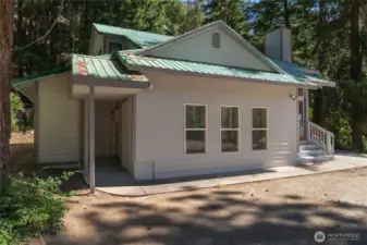 Enjoy a large family room with separate access to covered porch and wood shed.