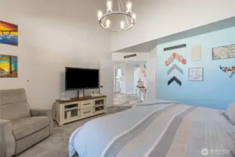 Primary suite offers large bedroom with high ceilings and tons of naturall light.
