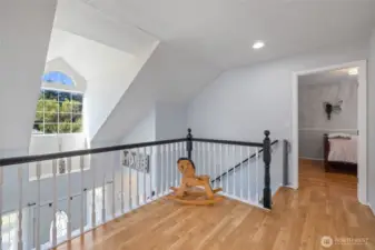Spacious landing at the top of stairs offers room to breath and maybe even do some yoga!