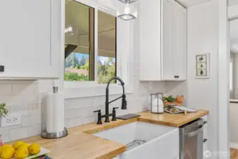 Butcherblock countertops with farm sink.