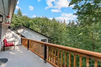Private and peaceful sitting area off primary overlooking Woods Creek.