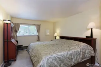 Large main bedroom with room for a king bed, dresser and nightstands