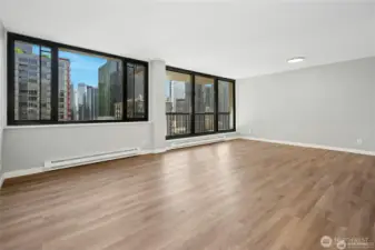 Looking from living room to dining area, kitchen is to the right