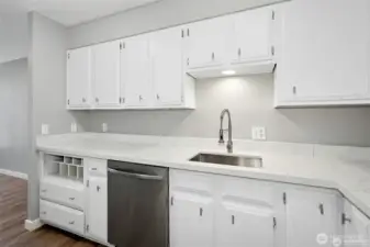 Kitchen with new quartz counter tops, sink and faucet