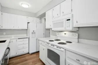 To the right of the refrigerator is a doorway