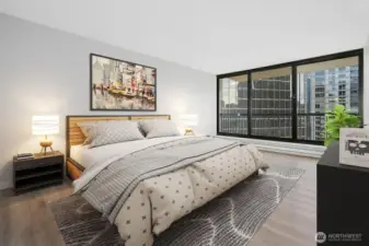 Primary bedroom with windows are facing to the east, primary bathroom and closet to the left