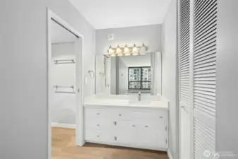 Primary bathroom vanity with bathtub/shower and toilet