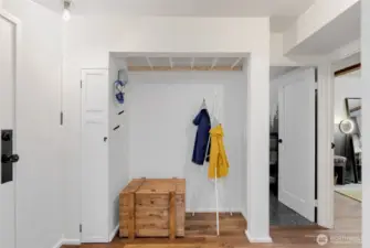 Closet storage and also a hanging rail for a bicycle.