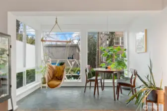 The light-filled space makes an excellent place for plants and to dine, read and relax.