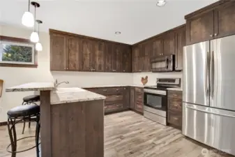 Like new custom kitchen! matching appliances with wood cabinetry.