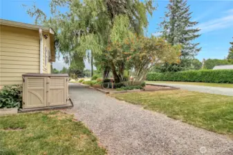 Side entry from the carport out front. walk way between driveways.