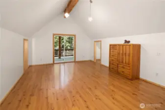 Upstairs master bedroom area with tons of storage space and slider out to covered front porch deck