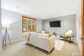 This family room can accommodate large pieces of furniture for maximum seating to entertain.