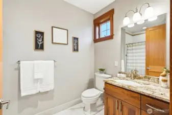 Main floor ensuite full tile bath; granite, gorgeous cabinetry, heated floors.