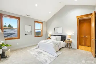 Third bedroom showing the vaulted ceiling. Another large closet visible through bedroom door.