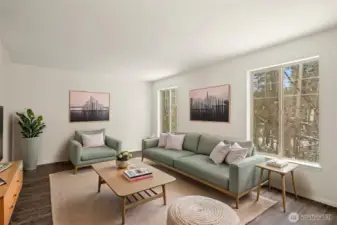 The Living room is bright and full of natural light with outdoor feel right outside your windows!