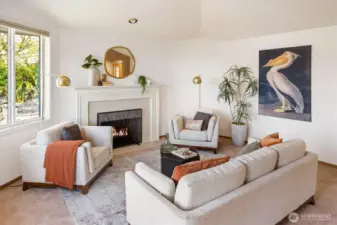 Entertain guests in the Great room with vaulted ceilings and a wood burning fireplace.