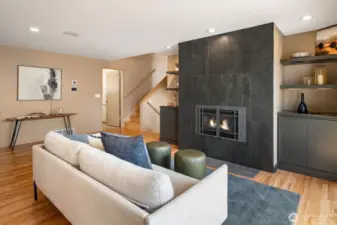The den has a cozy gas fireplace perfect for lounging.