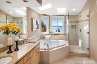 Relax in the 5-pcs bath with vaulted ceilings and a skylight.