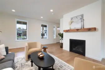 Living room with gas fireplace in primary dwelling.